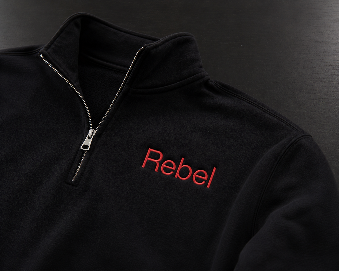 Rebel quarter-zip with red embroidered logo